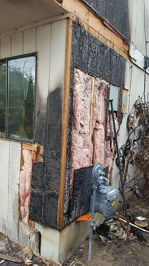 The side of a building that has been damaged by a fire.