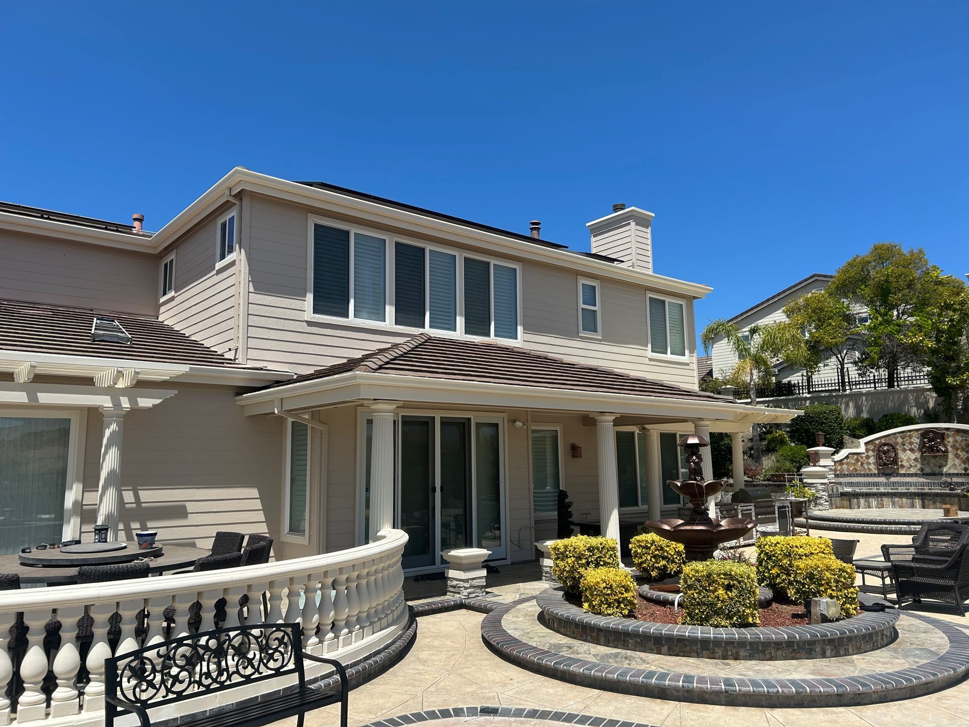A man is giving a box to a woman in front of a van full of boxes