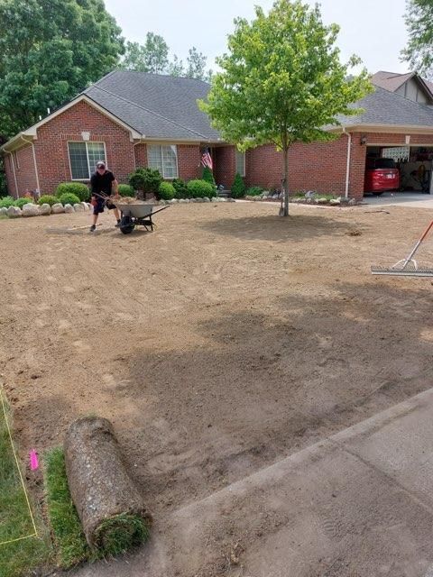 Man Pushing a Wheelbarrow