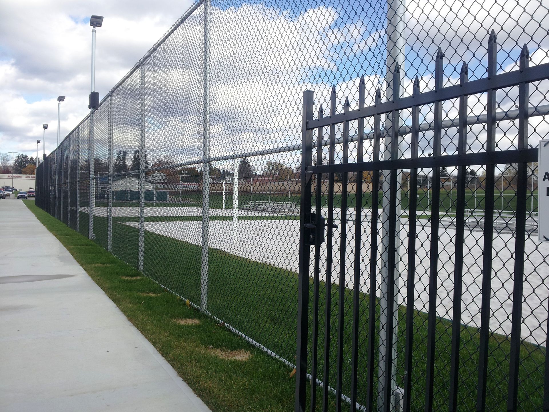 silver metal fence around park