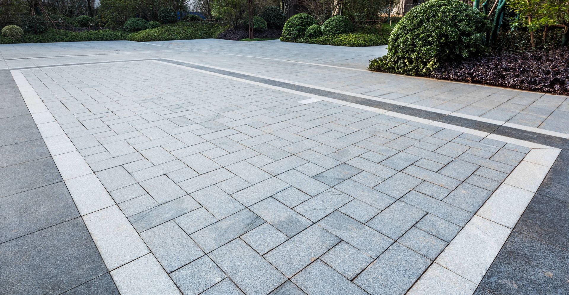 a brick driveway with a white line in the middle