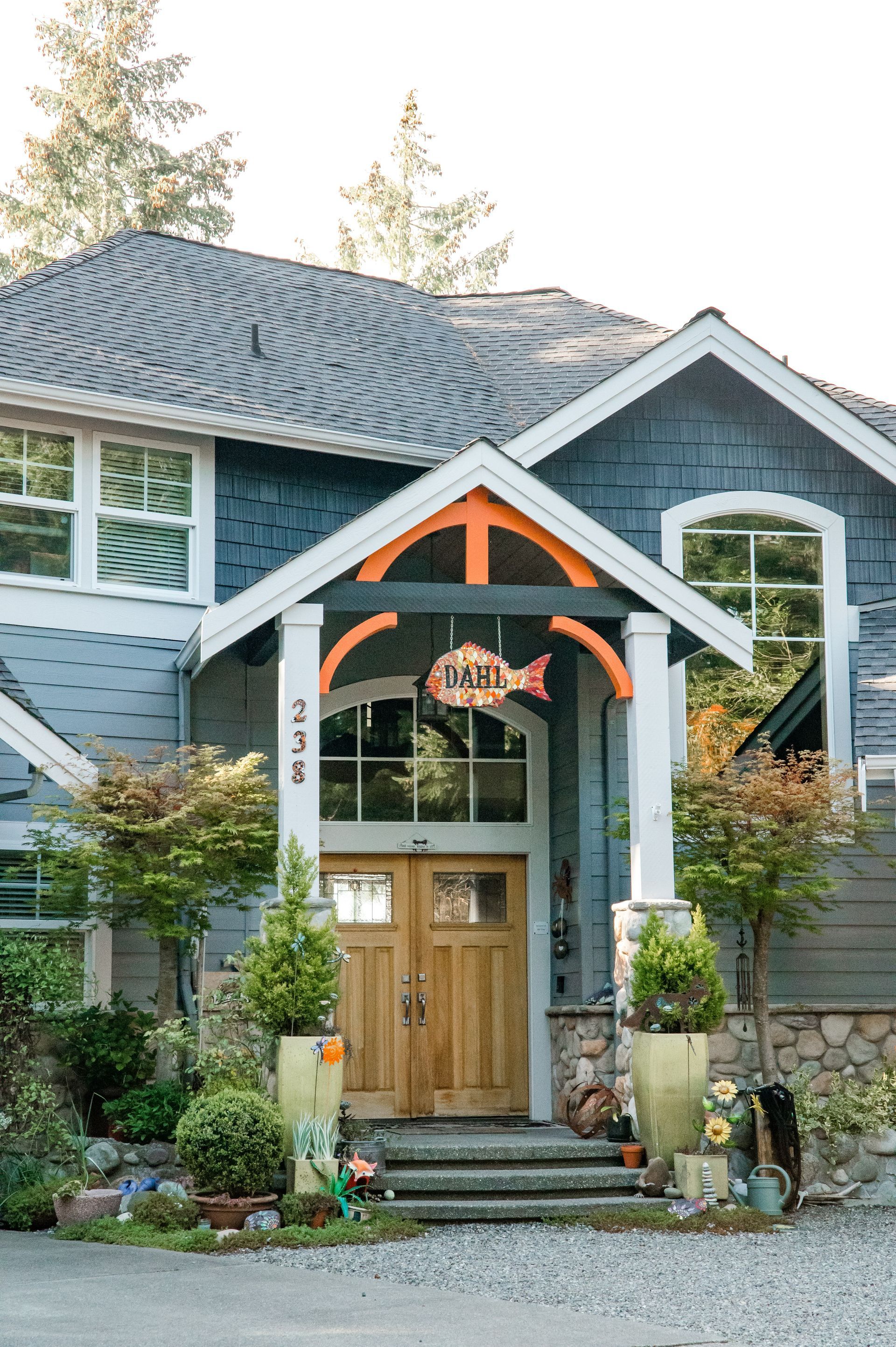 A house with a sign above the door that says