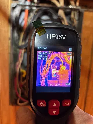 Thermal camera showing electrical panel with hot spots.