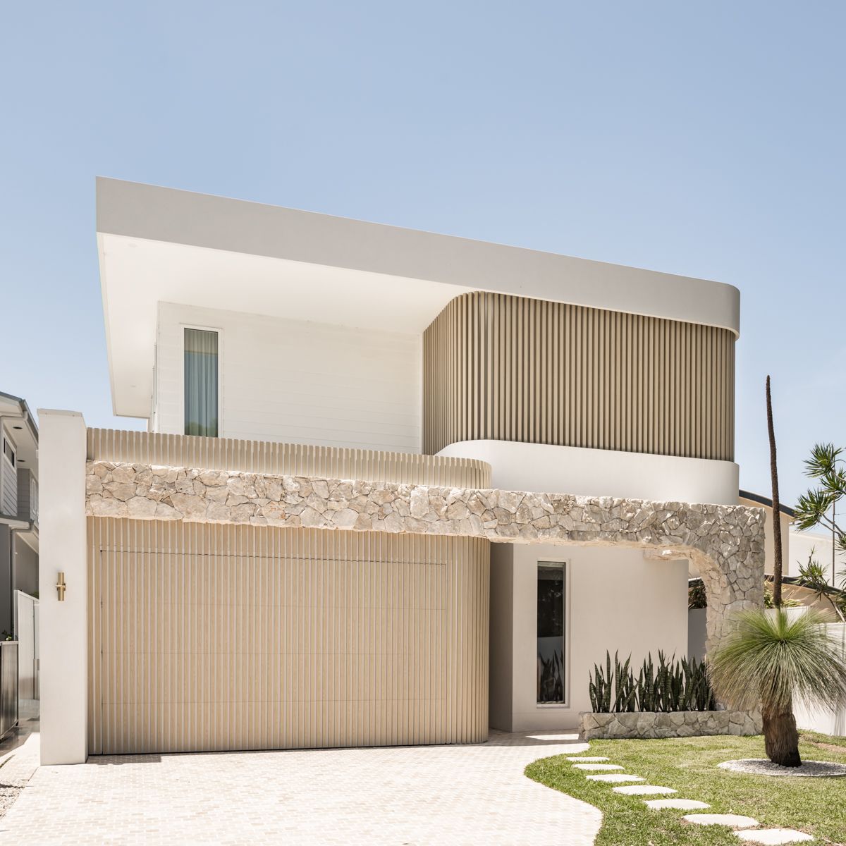 Modern Two-storey House at Dusk With Palm Trees — SDC Building Design In Kiama, NSW