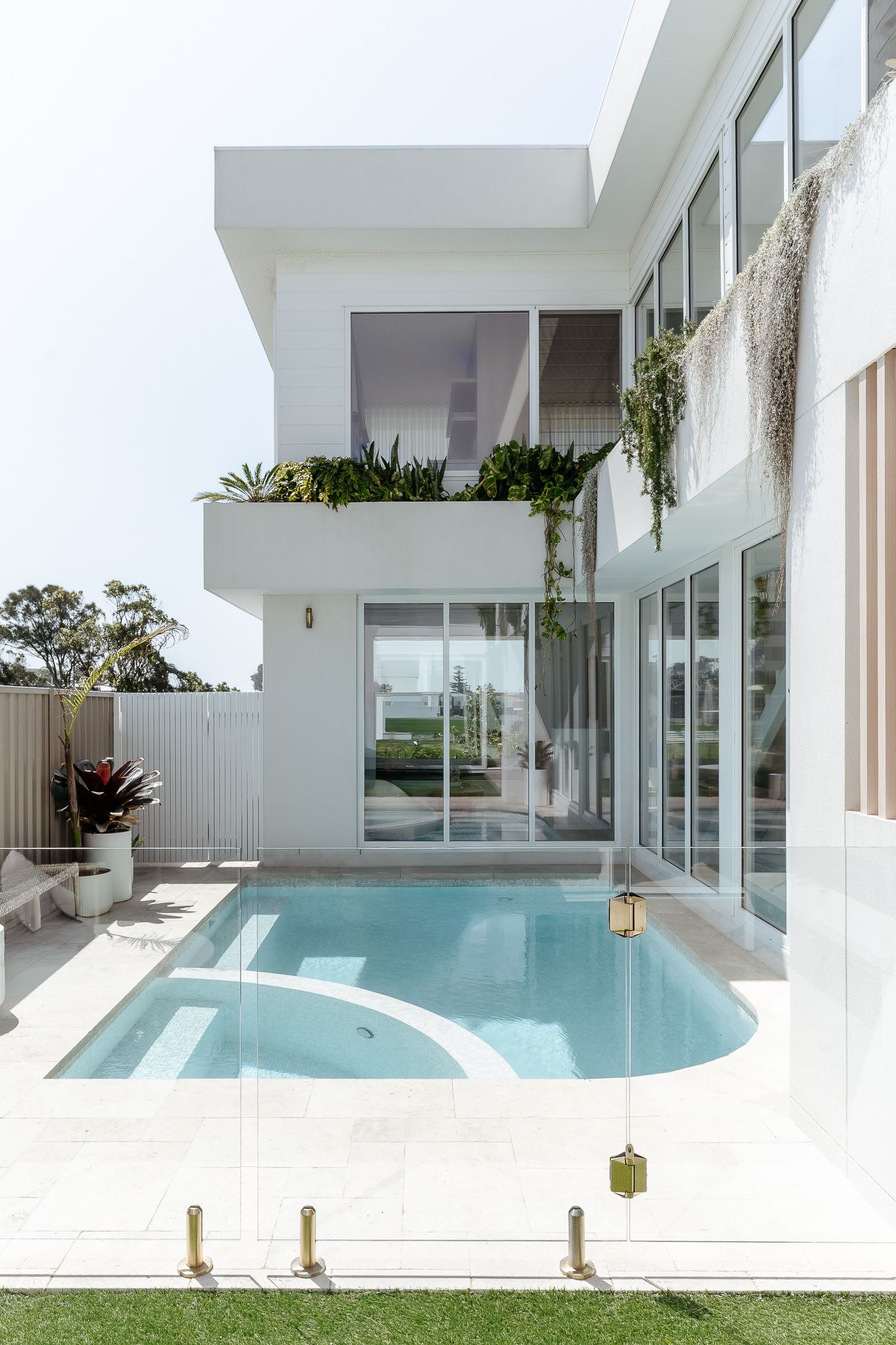 White modern house with a pool and greenery  — SDC Building Design In Kiama, NSW