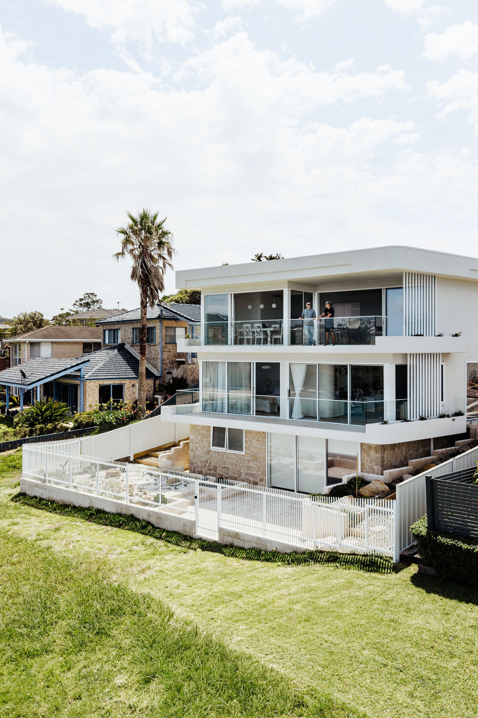 Modern Two-story House With Stone Accents, Green Grass, and a Stone Pathway — SDC Building Design In Kiama, NSW