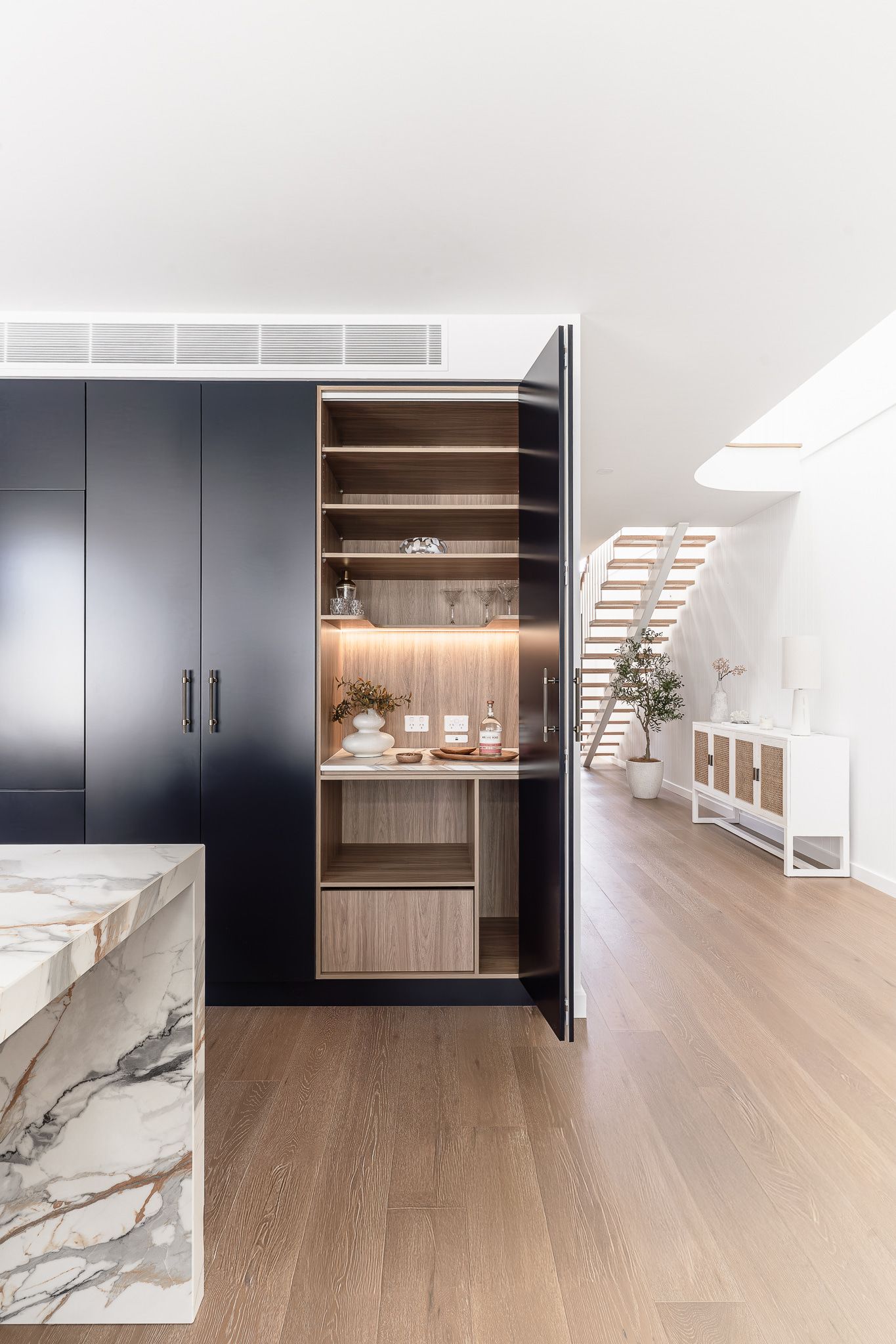Kitchen With Marble Countertop and Navy Blue Cabinets — SDC Building Design In Kiama, NSW
