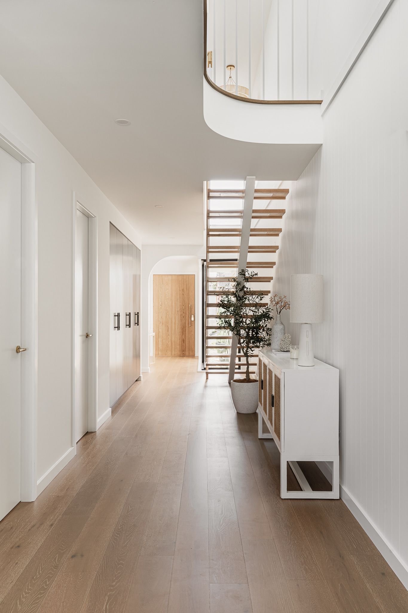 Hallway With White Walls, Wooden Floor,and Staircase — SDC Building Design In Kiama, NSW