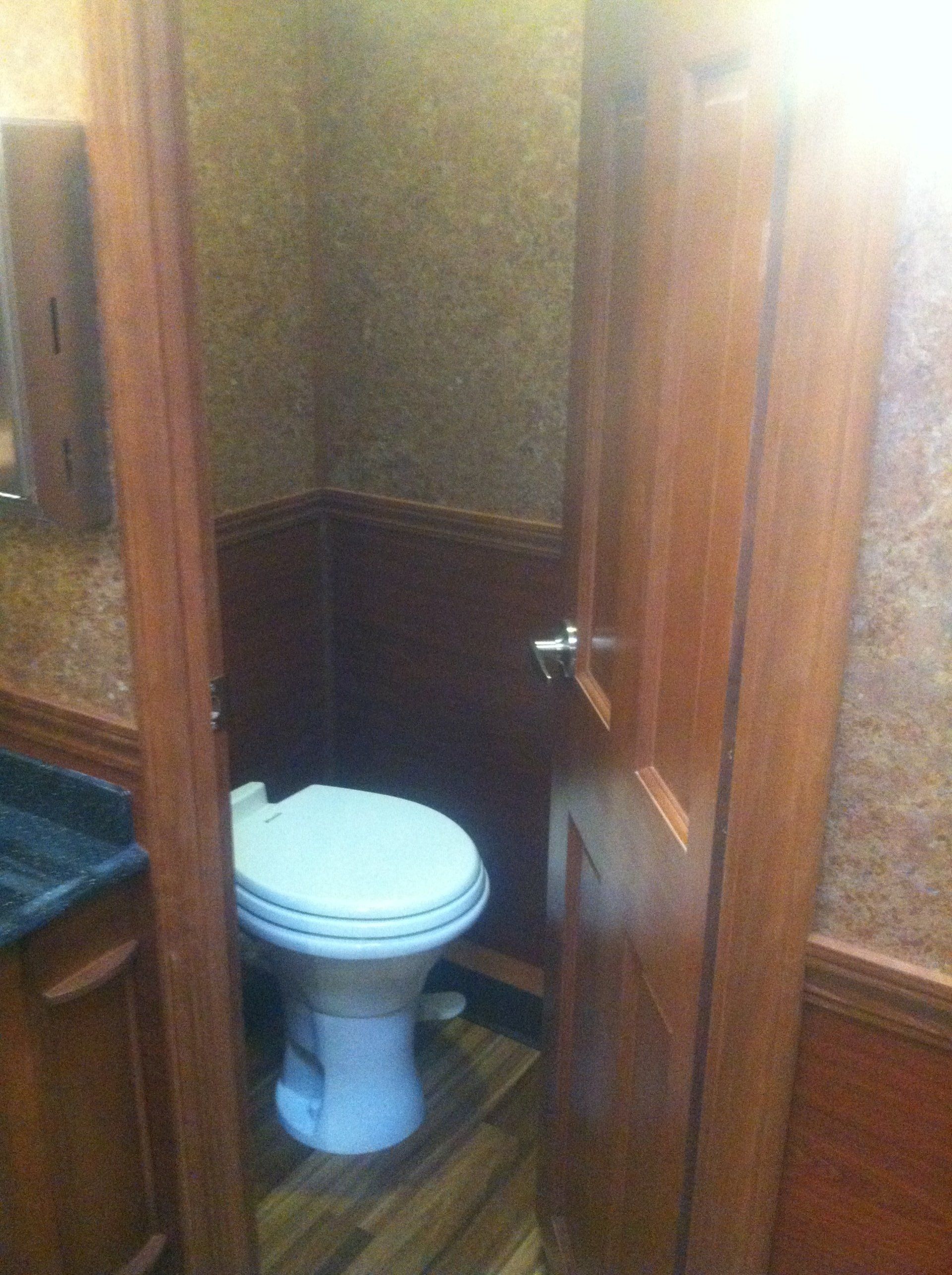 A bathroom with a toilet and a sink in it