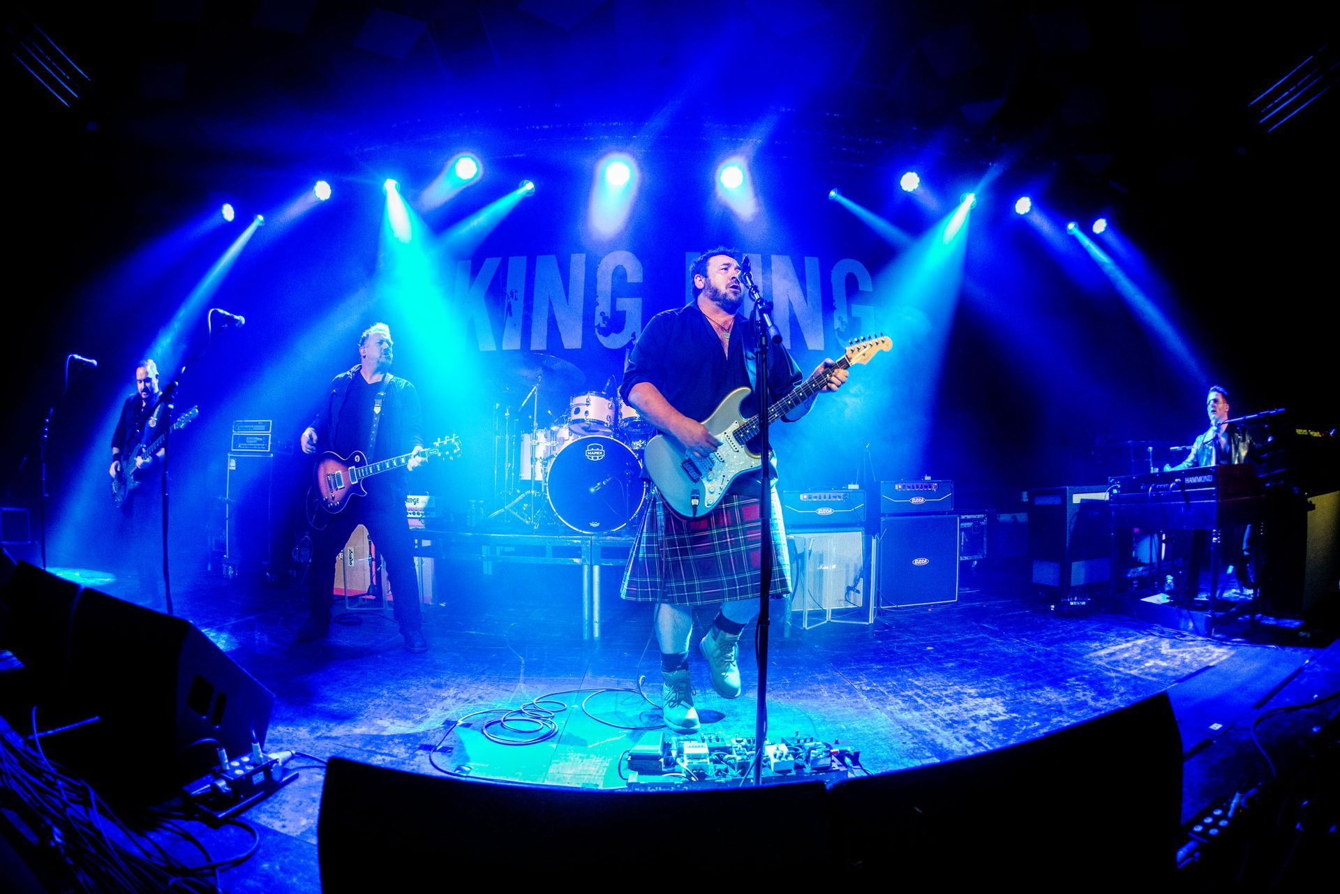 KING KIING band members in group smiling 