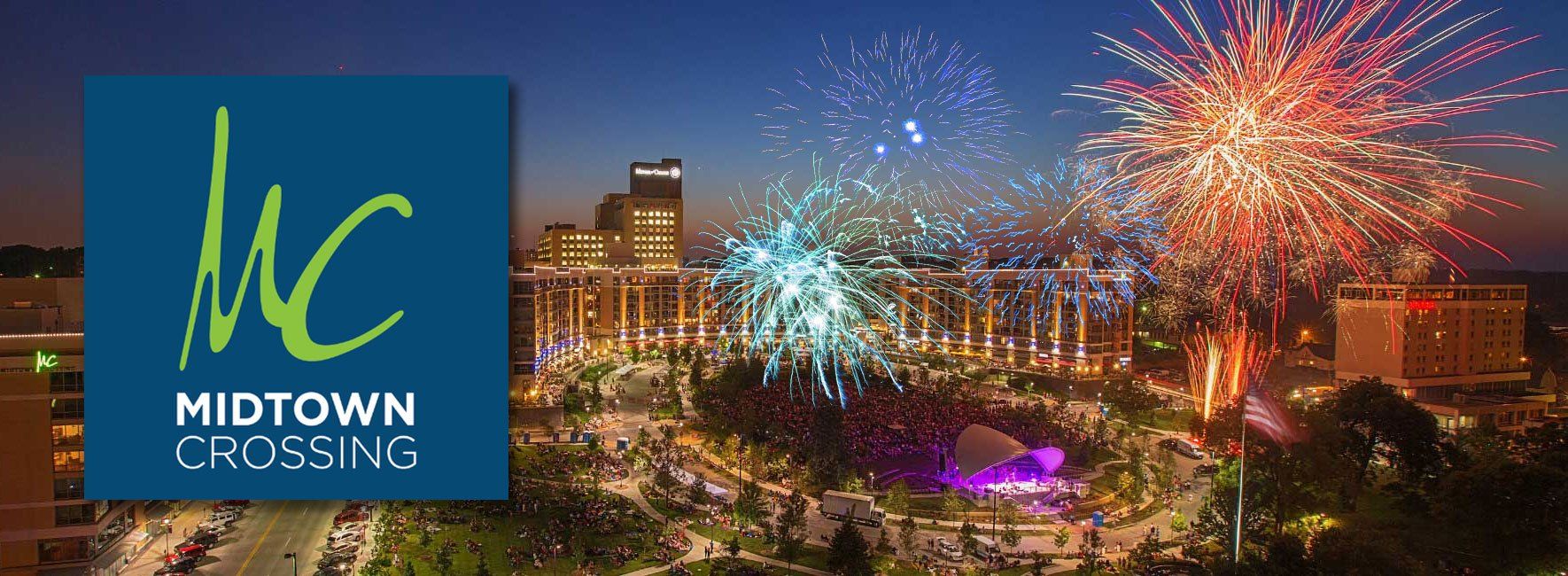 A logo for midtown crossing with fireworks in the background