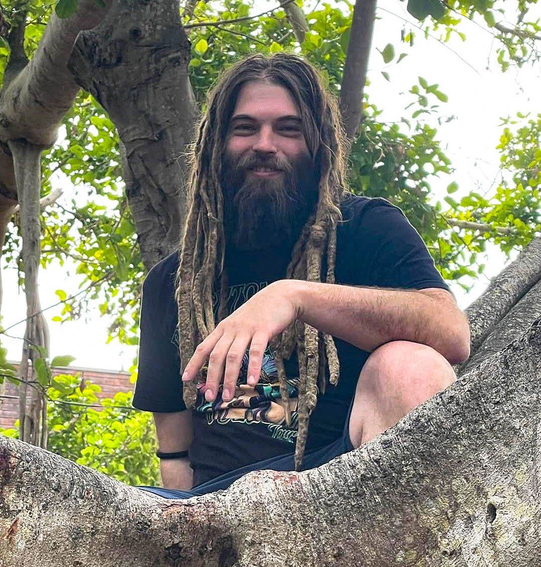 One man sitting in a tree