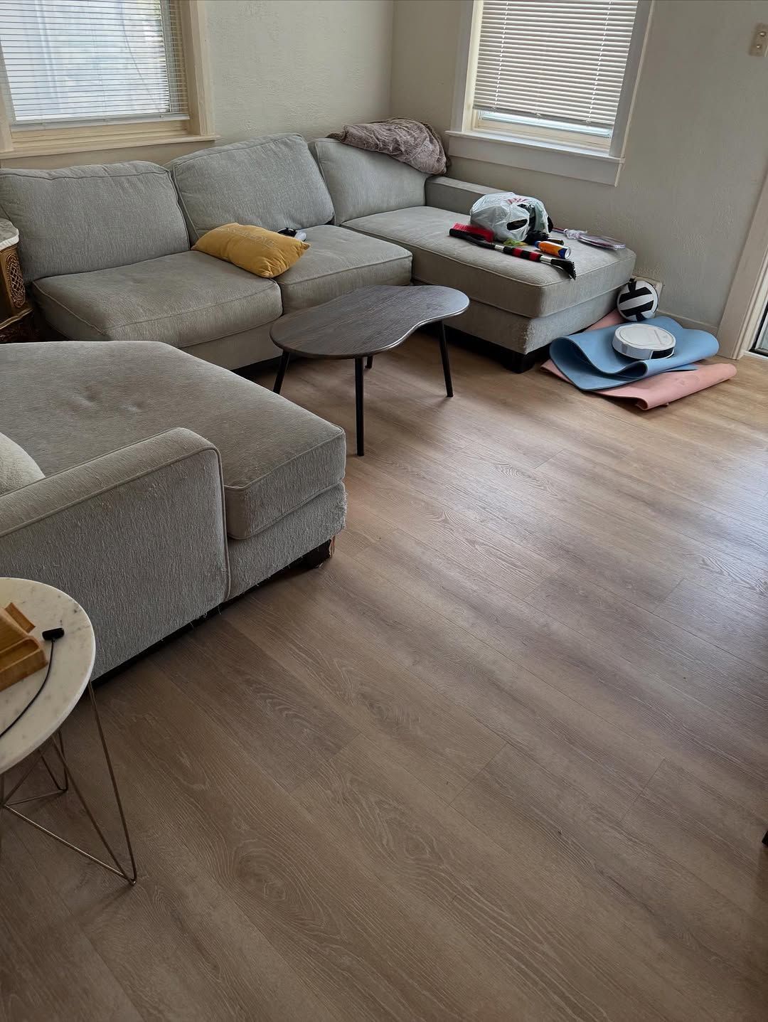 a kitchen under construction with blue tape on the floor .