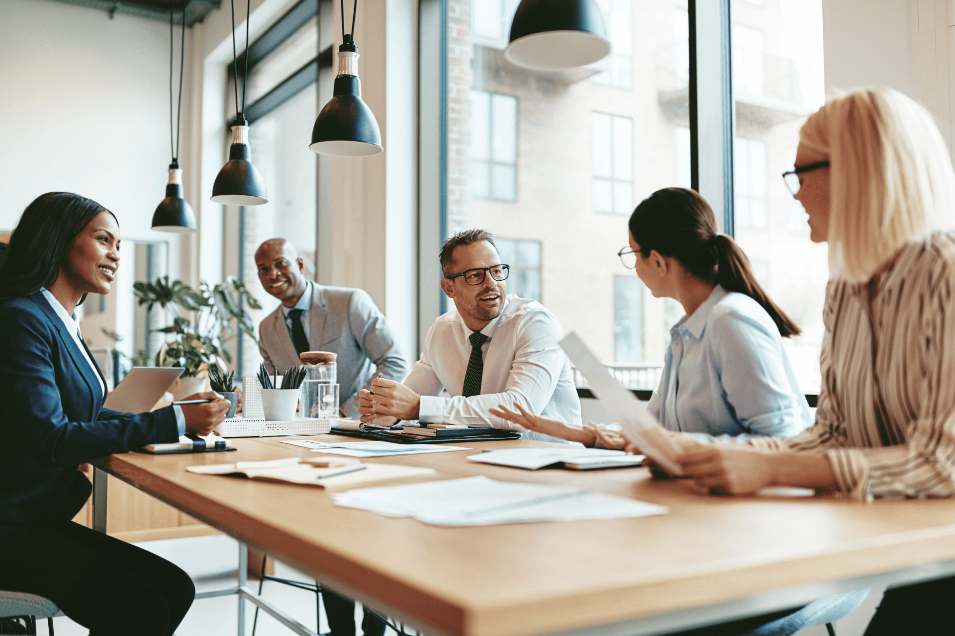 Small business owner discussing group health insurance options with an insurance advisor in Connecticut