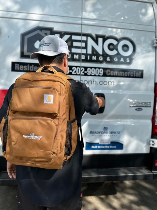 A person wearing a Carhartt backpack opens the door of a plumbing van with 
