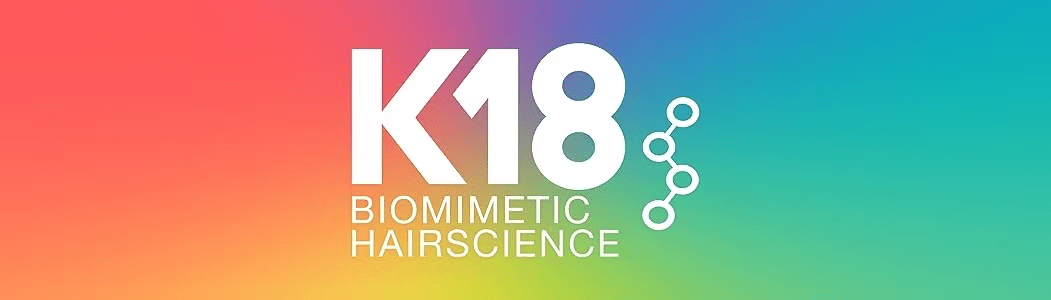 K18 Biomimetic Hairscience logo on a rainbow gradient background.