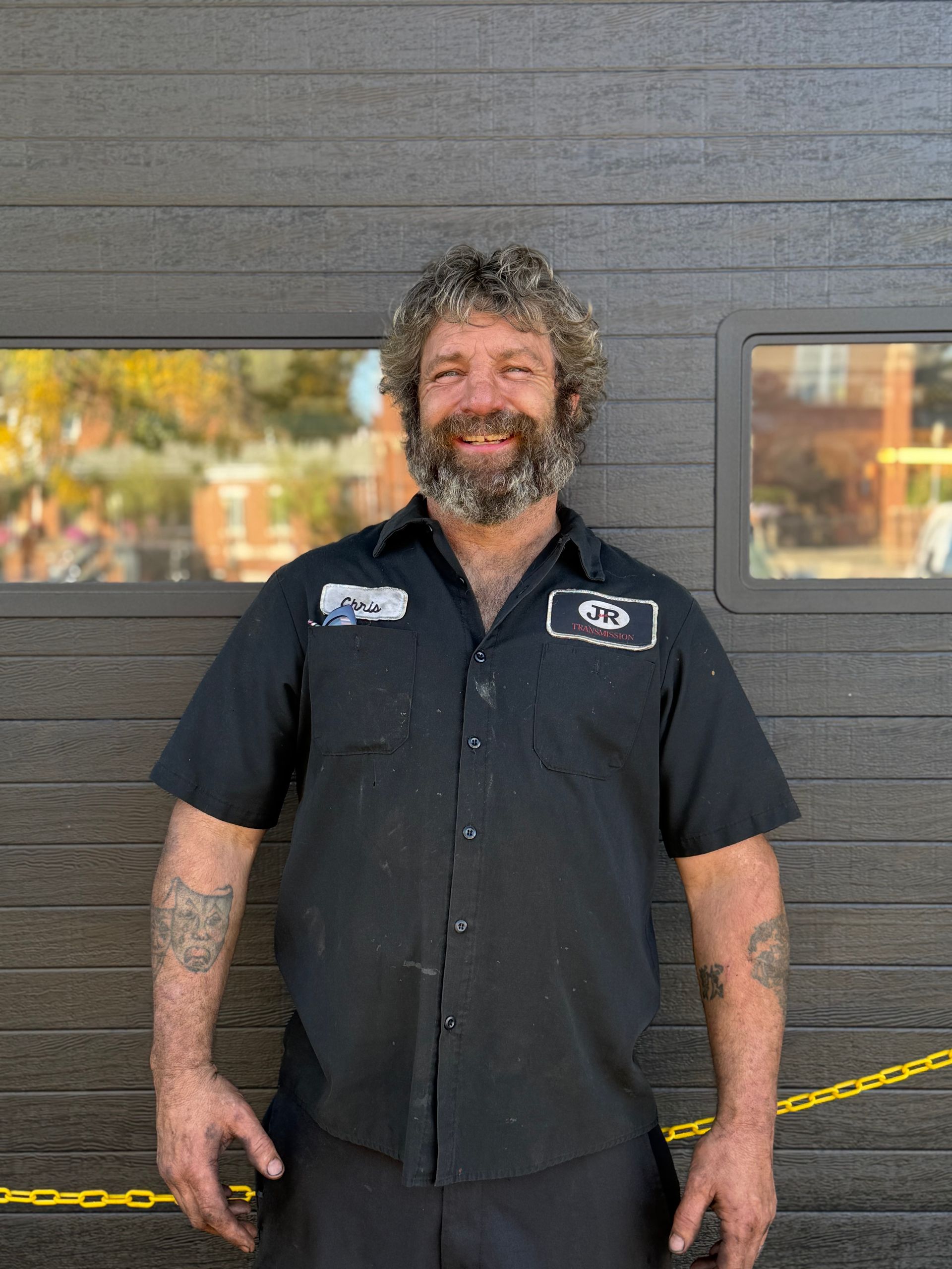 A man with a beard and a helmet on his head.