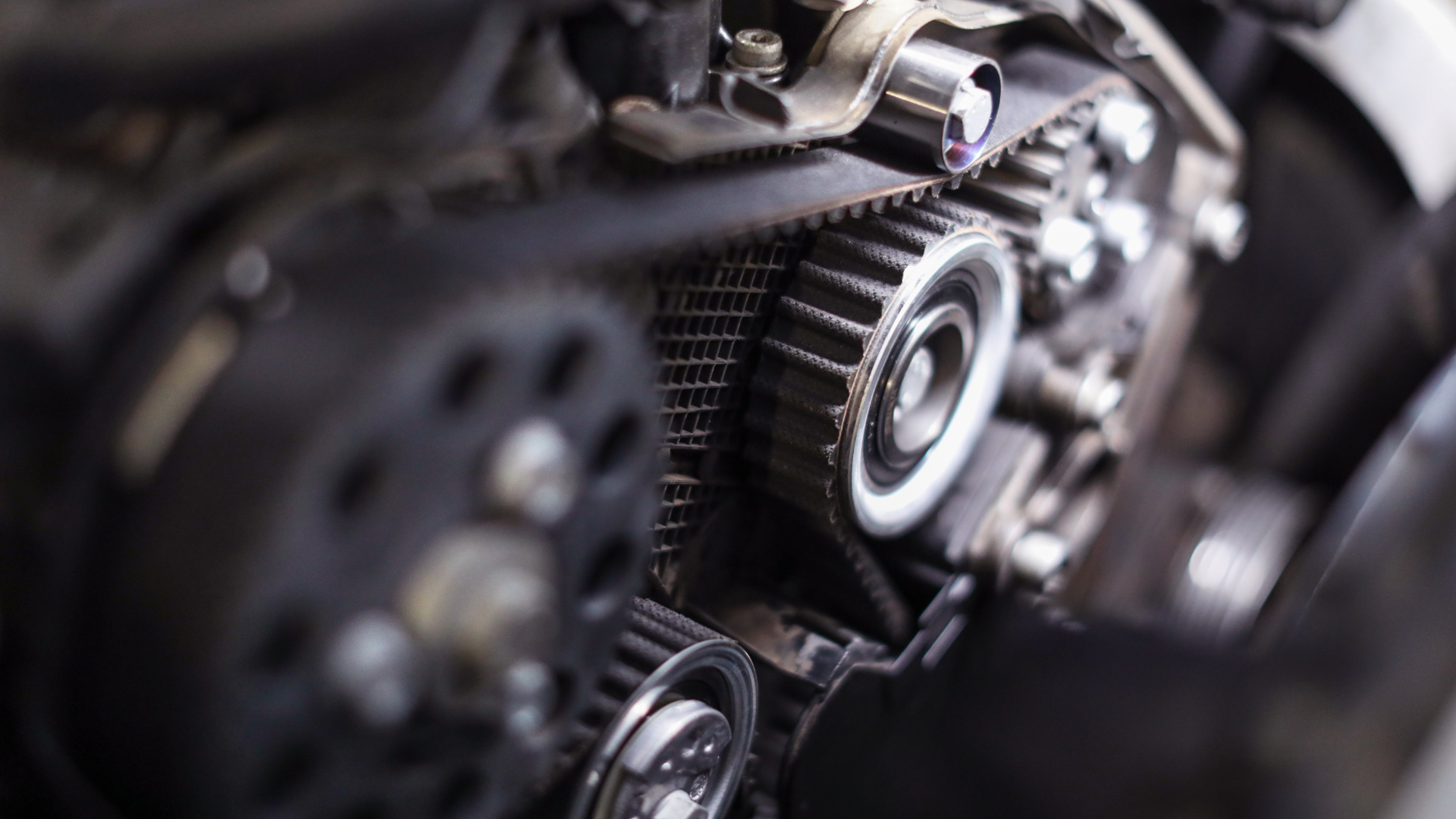 A close up of a belt on a car engine.