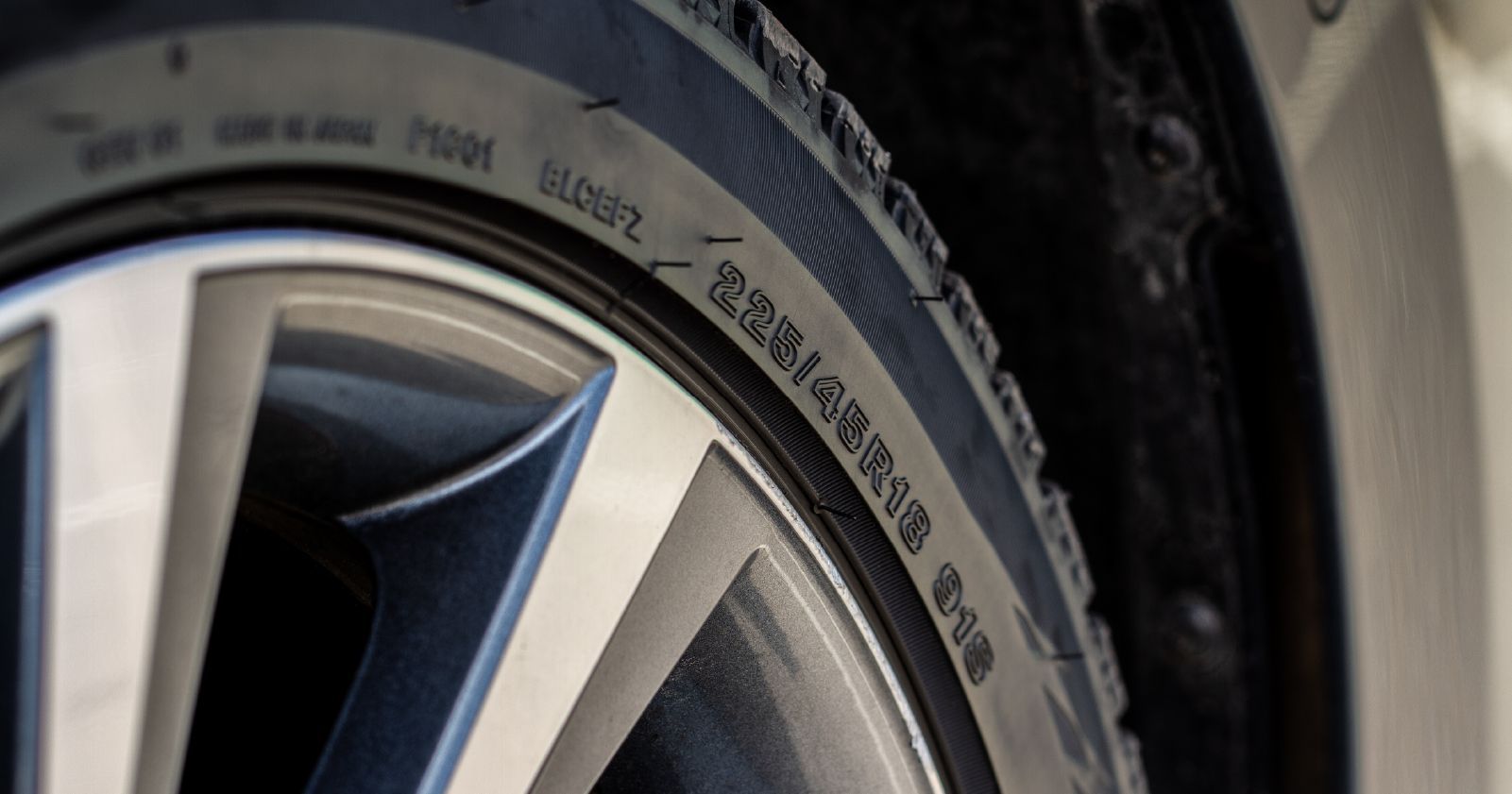 a close up of a tire on a car wheel to accompany a how to find your tire size article