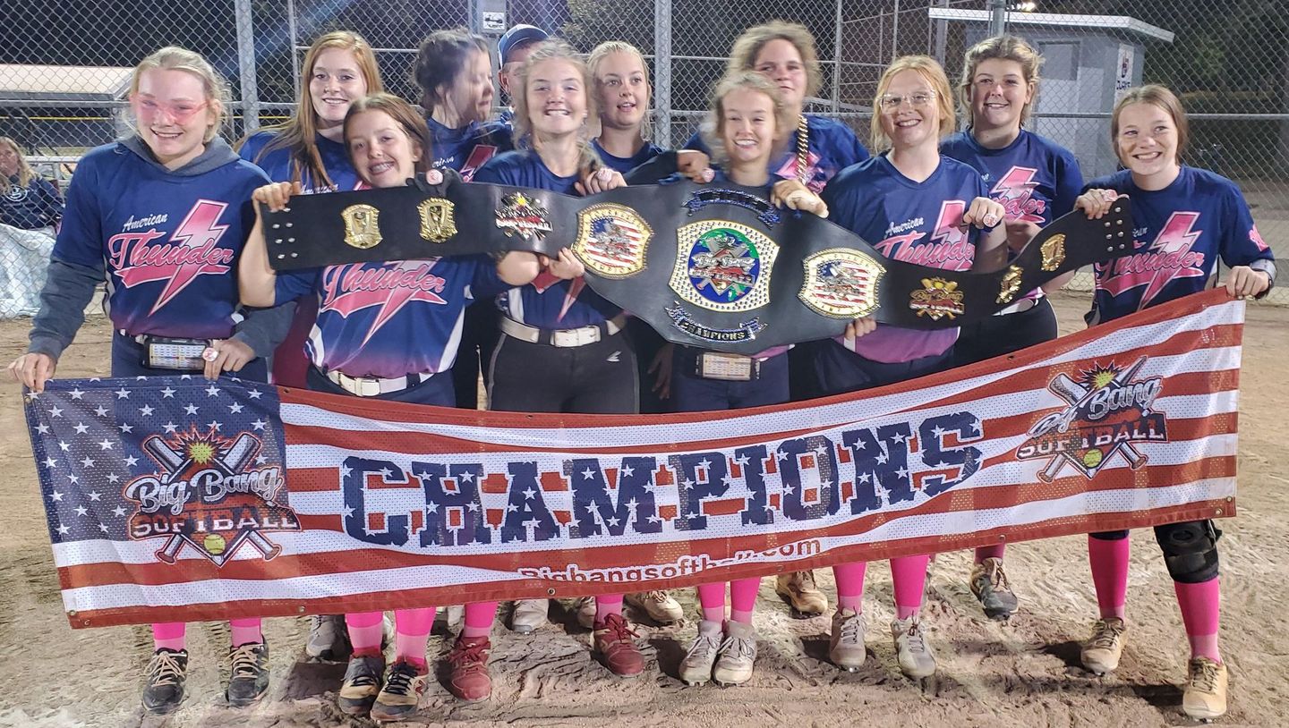 A group of girls holding a banner that says champions