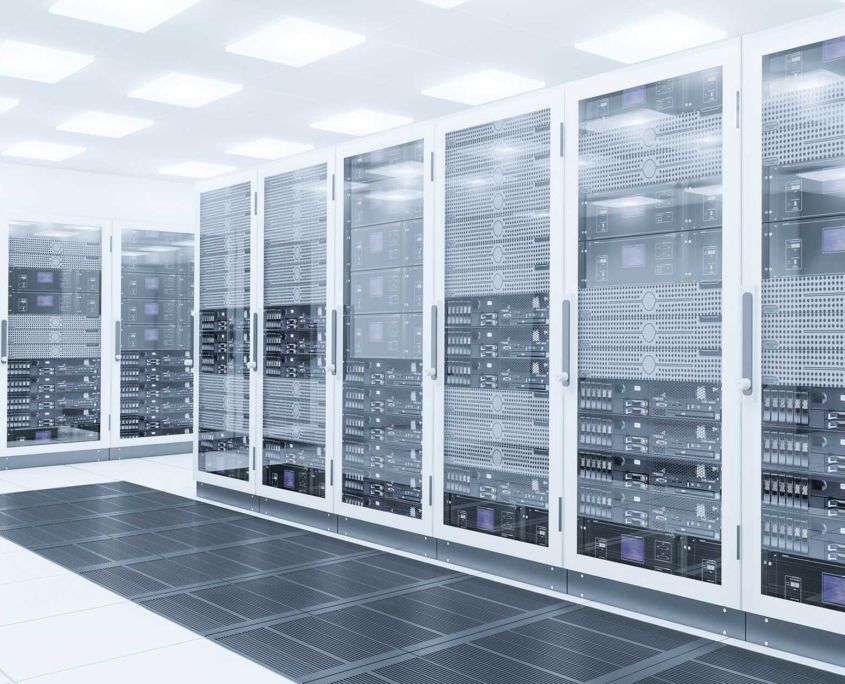 A row of servers in a data center with glass doors.