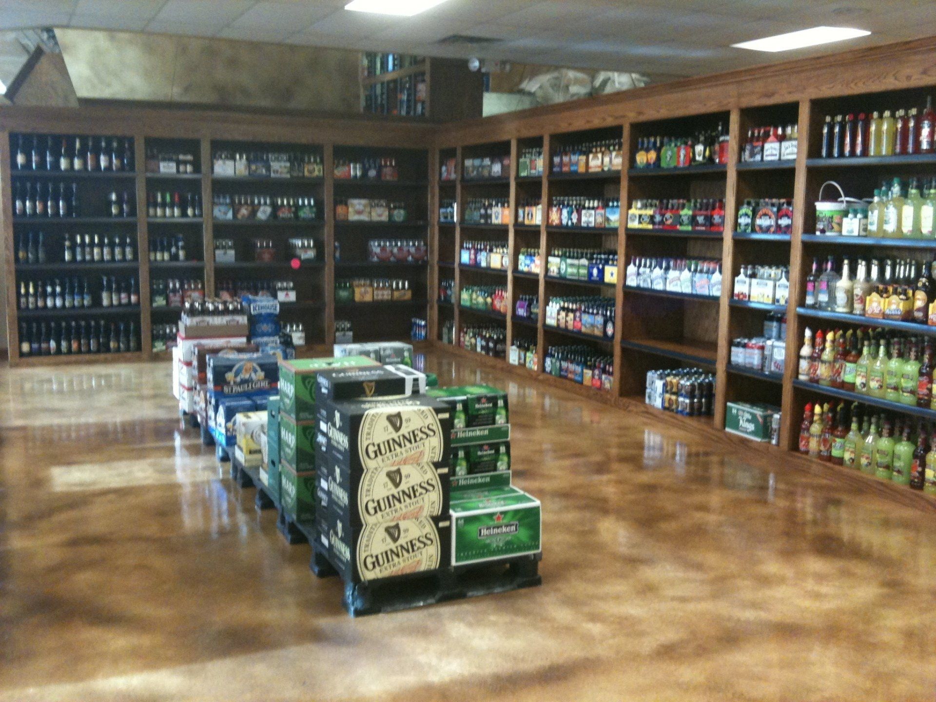 A liquor store filled with lots of beer including guinness
