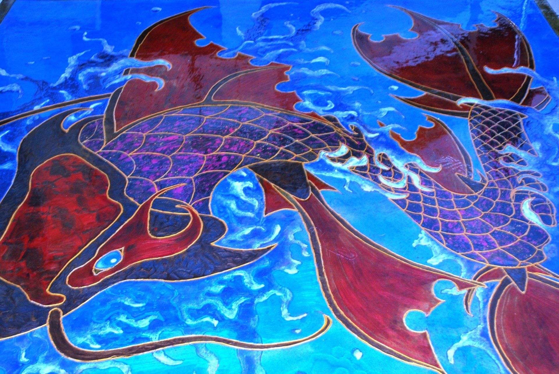 A painting of a dragon on a blue background
