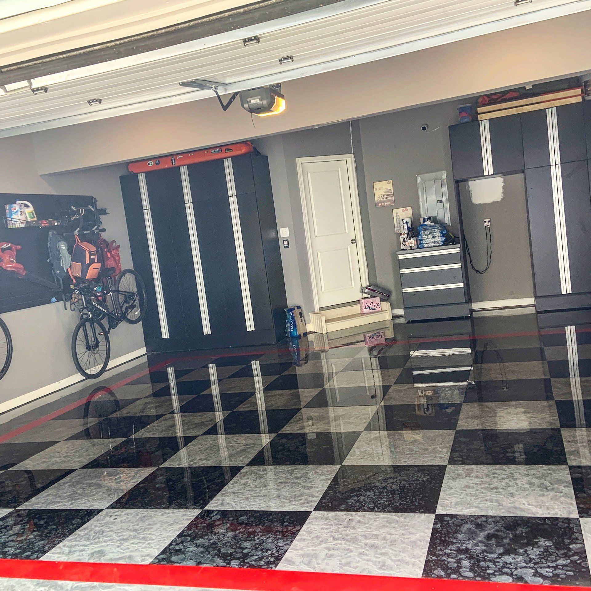 A black and white checkered floor in a garage
