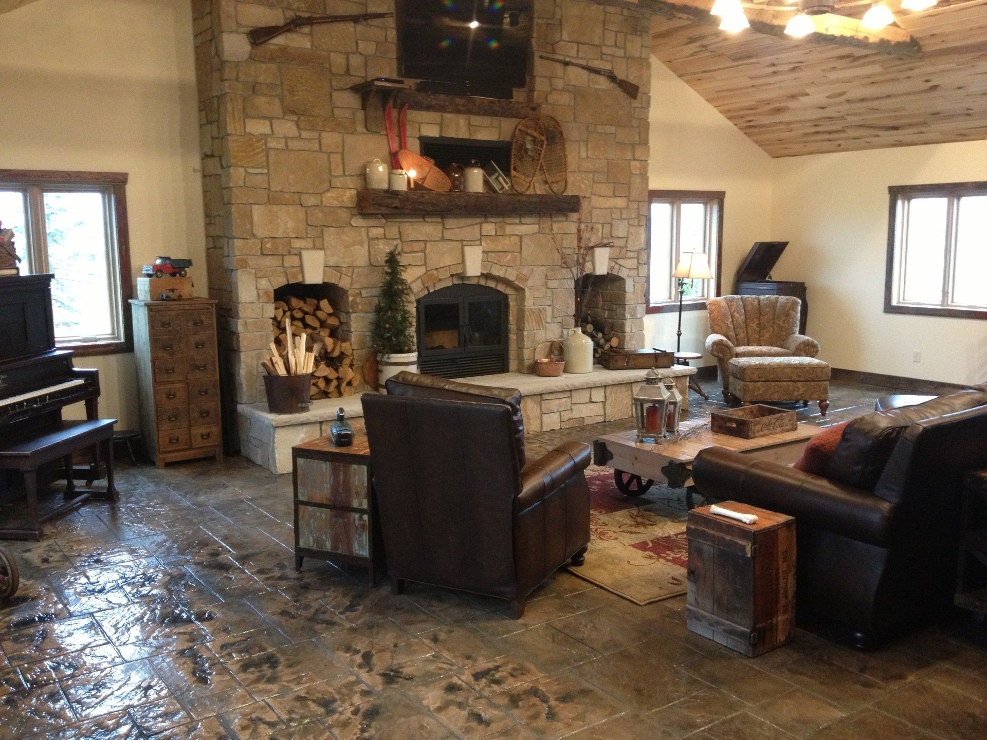 A living room with a fireplace and a piano