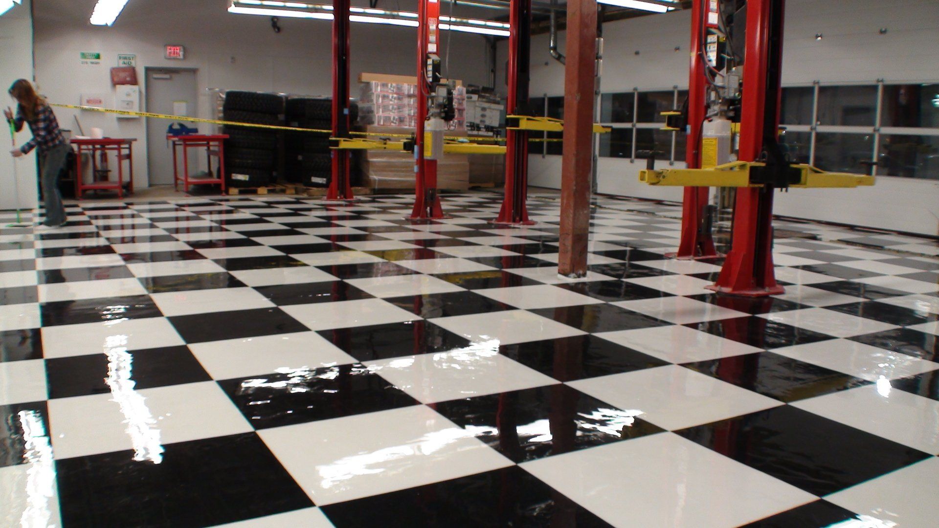 A black and white checkered floor in a garage