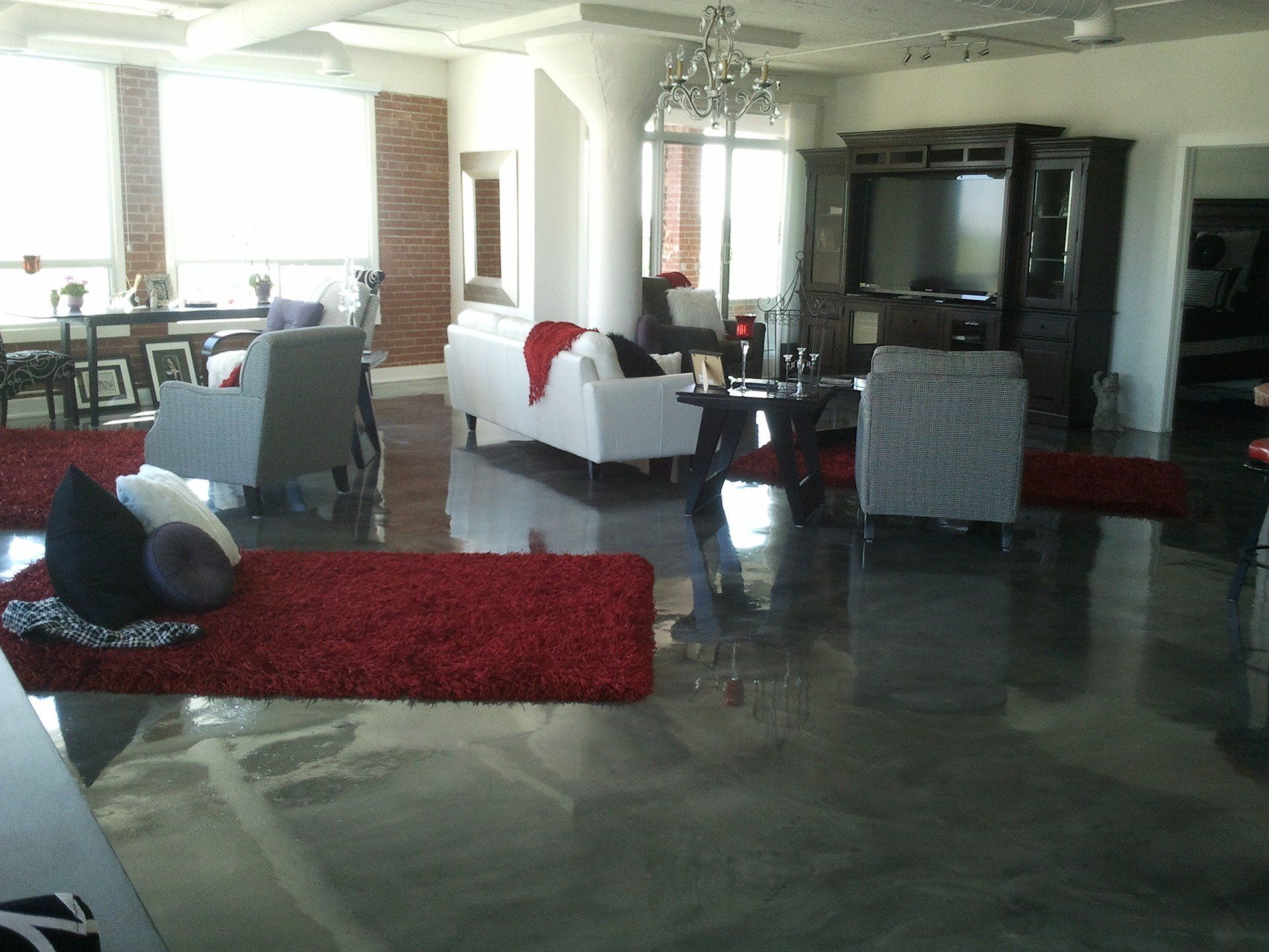 A living room filled with furniture and a television