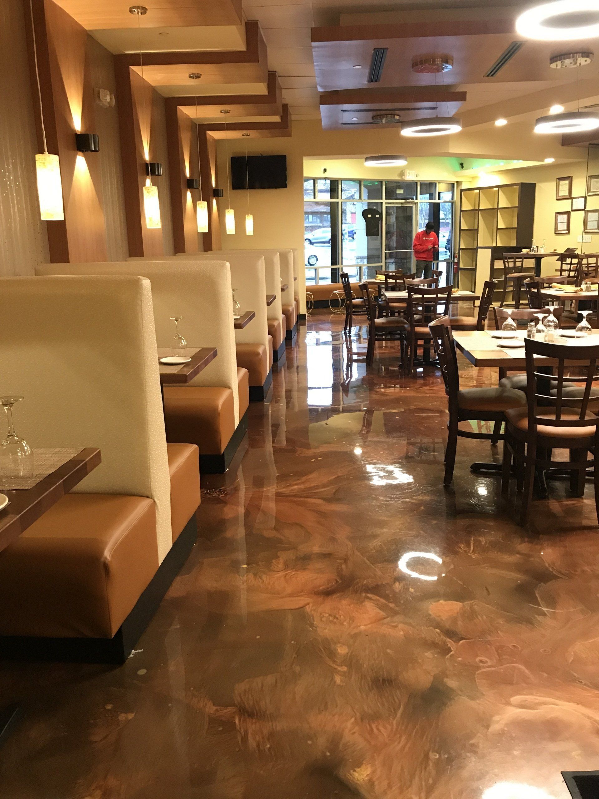 The inside of a restaurant with tables and chairs