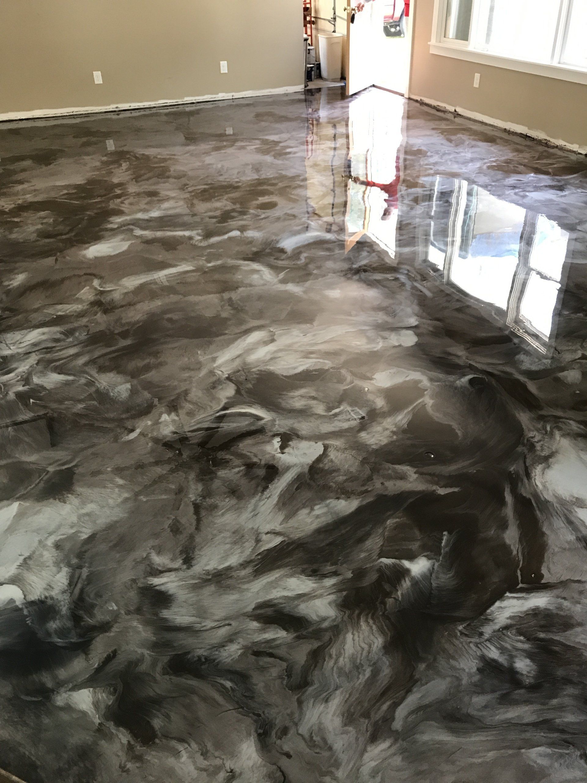 A living room with a shiny metallic floor.