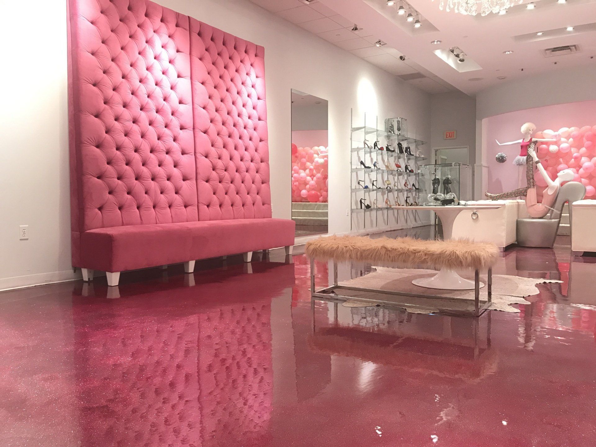 A room with pink furniture and a pink floor