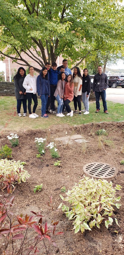 Earl L. Vandermeulen High School Environmental Club with adviser Jonathan Maletta (right). (Photo courtesy of Port Jefferson School District).