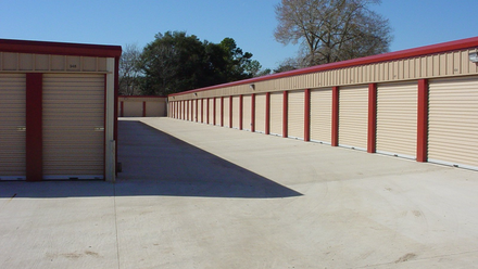 Self storage units in red paint - Storage services in Bryan TX