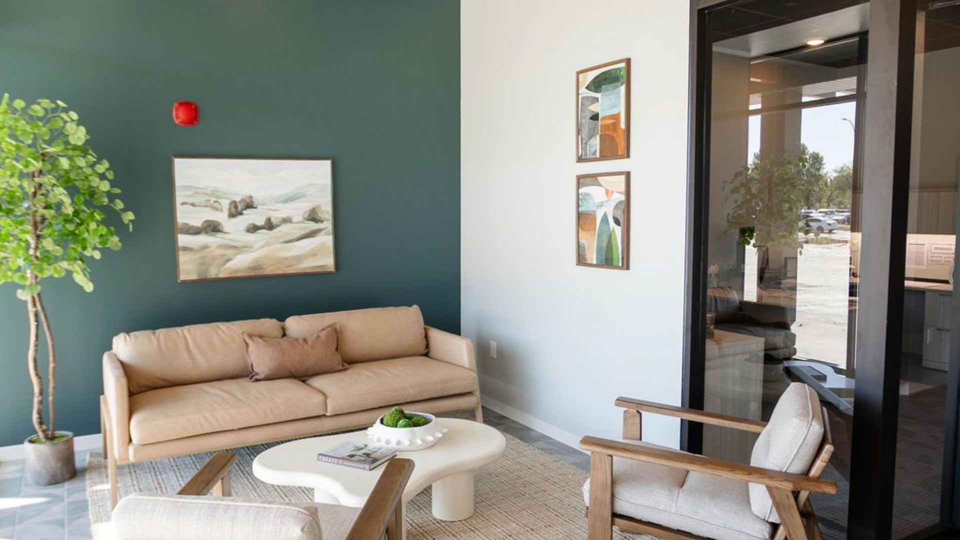 Rendering of a modern multi-story apartment building with a mix of brown, black, and white siding, on a street corner with cars.