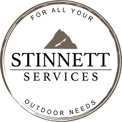 Logo for Stinnett Services with mountain graphic and text: 