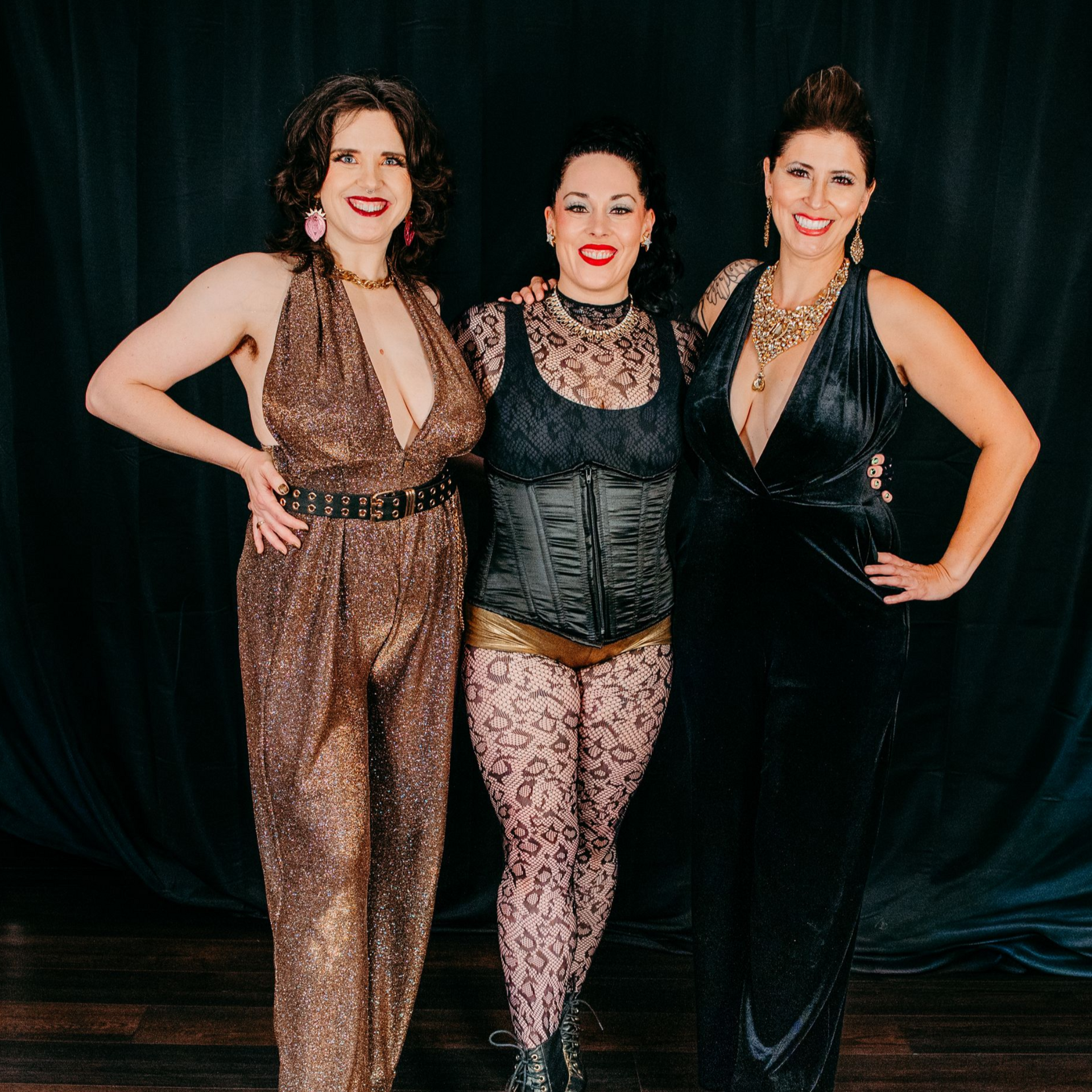 A woman in a black dress is holding a white cloth