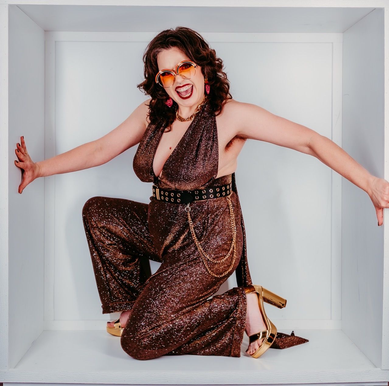 A woman is wearing a purple jacket and a black top.