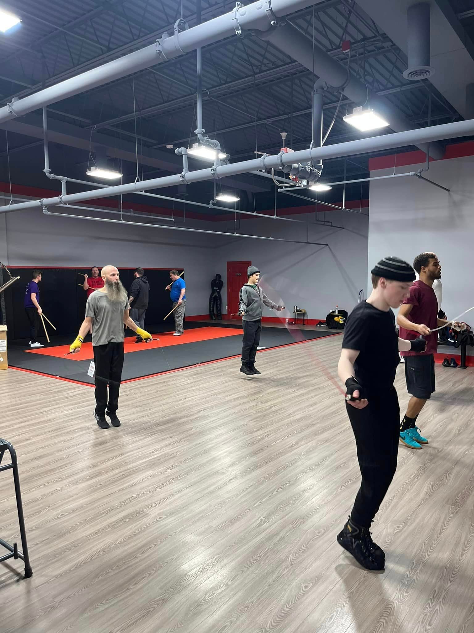 People working out and jump roping at champion boxing & fight club
