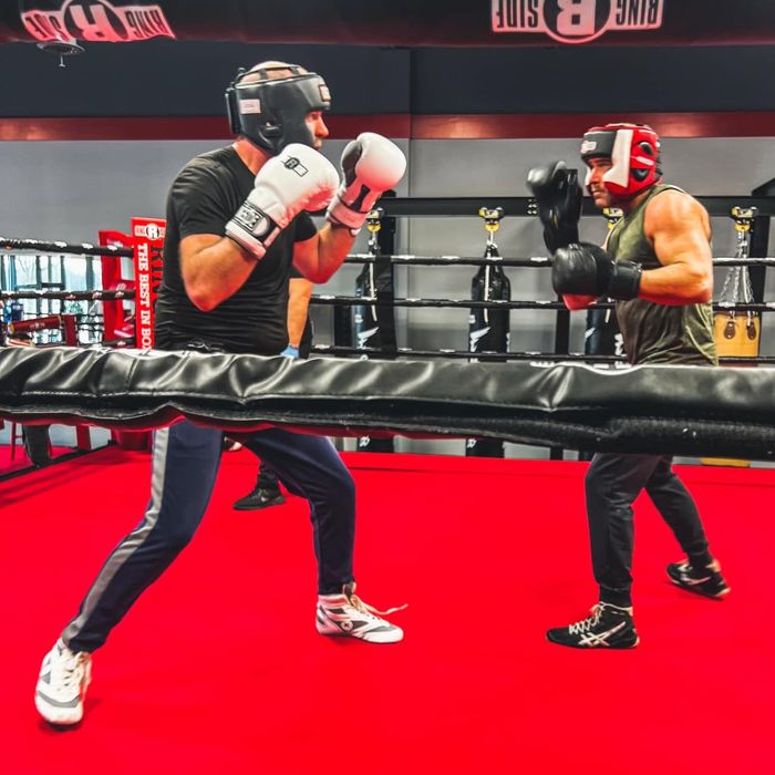 Two men boxing in the ring at champion boxing and fight club in chesterfield, mi