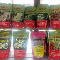 Row of colorful packaged seasoning or spice pouches on a store shelf