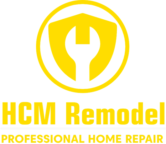 Yellow logo for "HCM Remodel". Features a wrench within a shield and circle. Text reads "PROFESSIONAL HOME REPAIR".