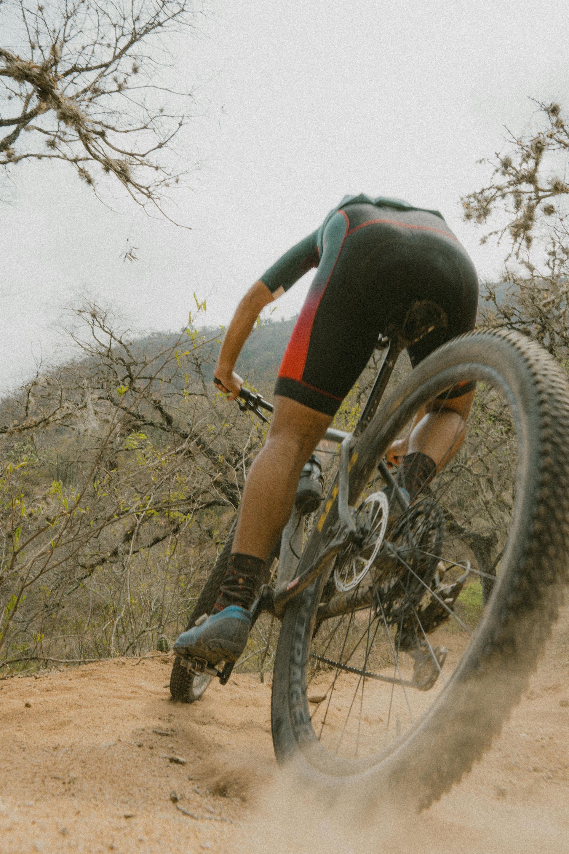 A Man is Working on a Bicycle in a Garage — Freedom Sports in Bundaberg Central, QLD