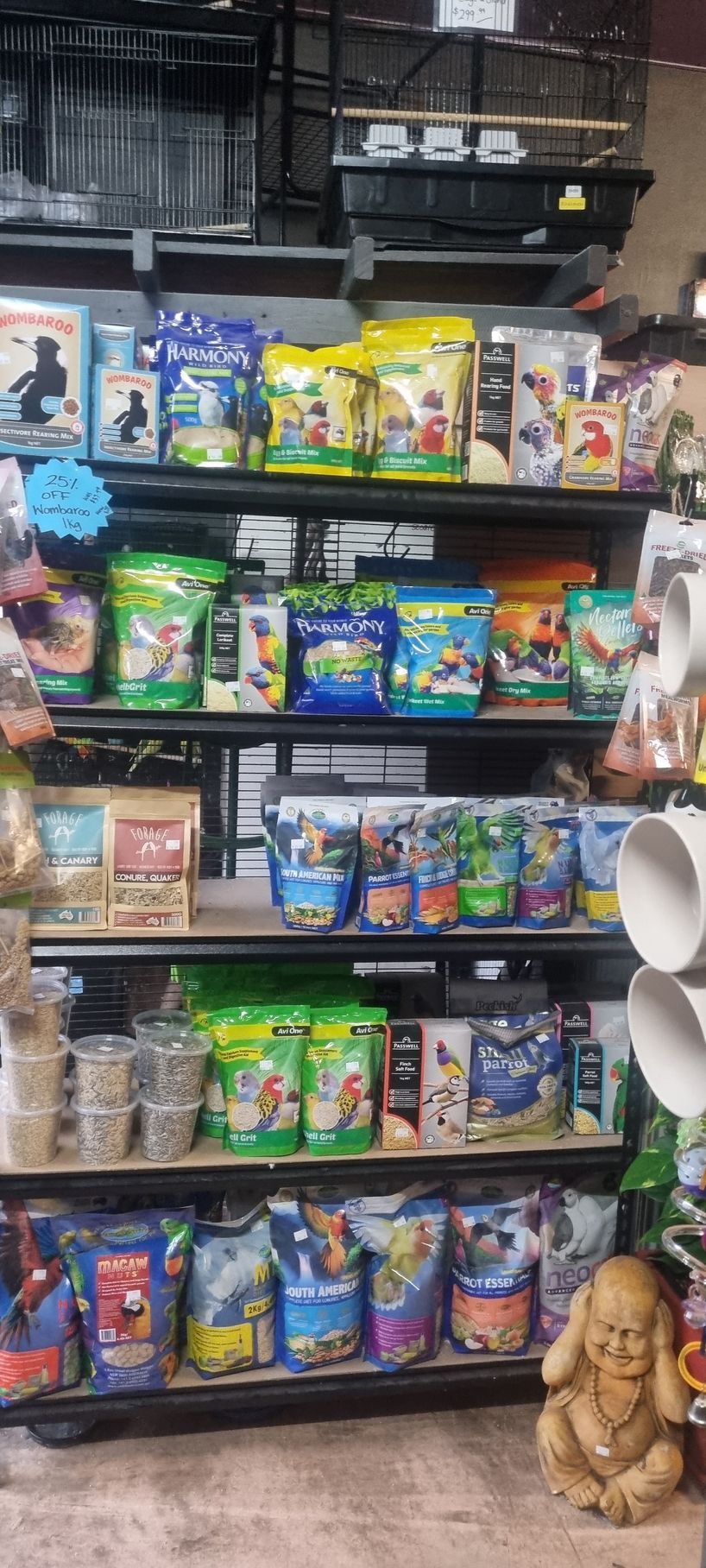 A shelf filled with bags of bird food in a store - Kempsey, NSW - Valley Garden Centre
