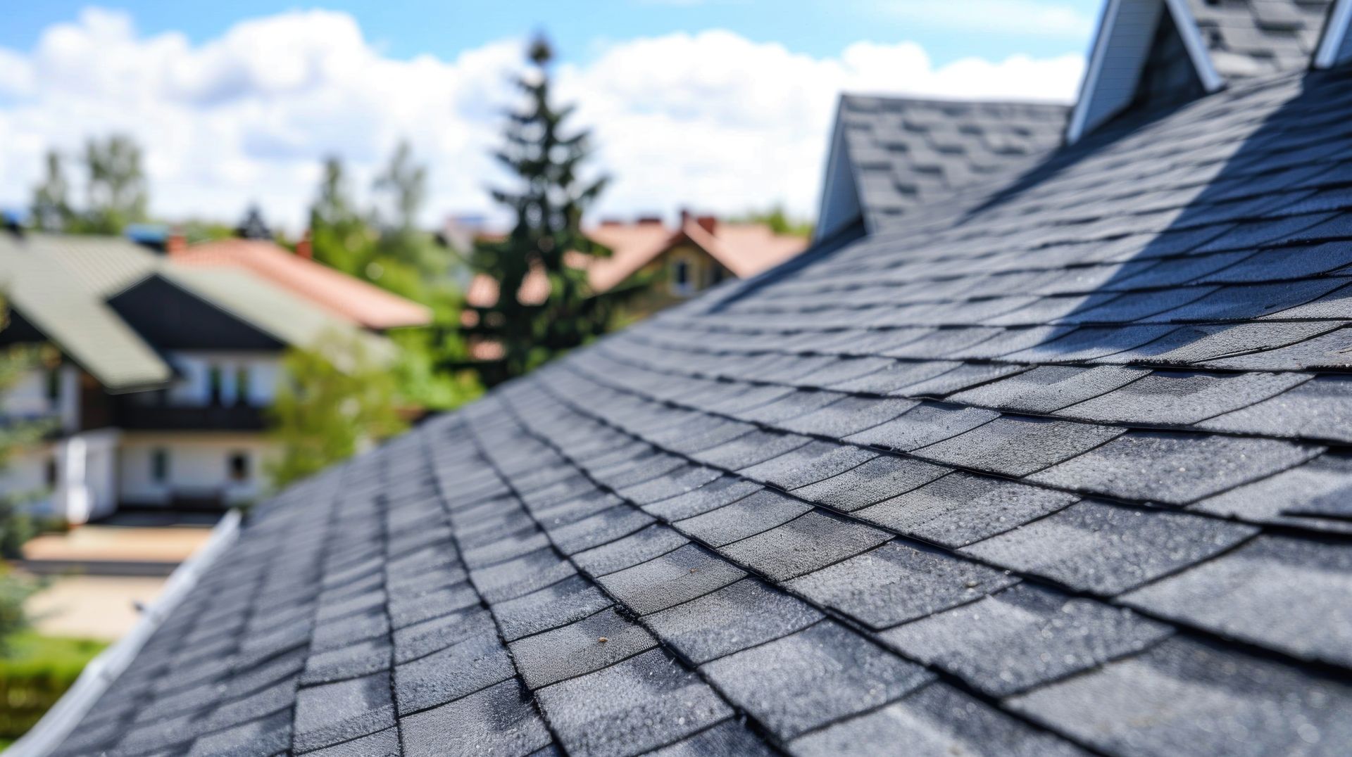 A close up of a roof with a lot of shingles on it.