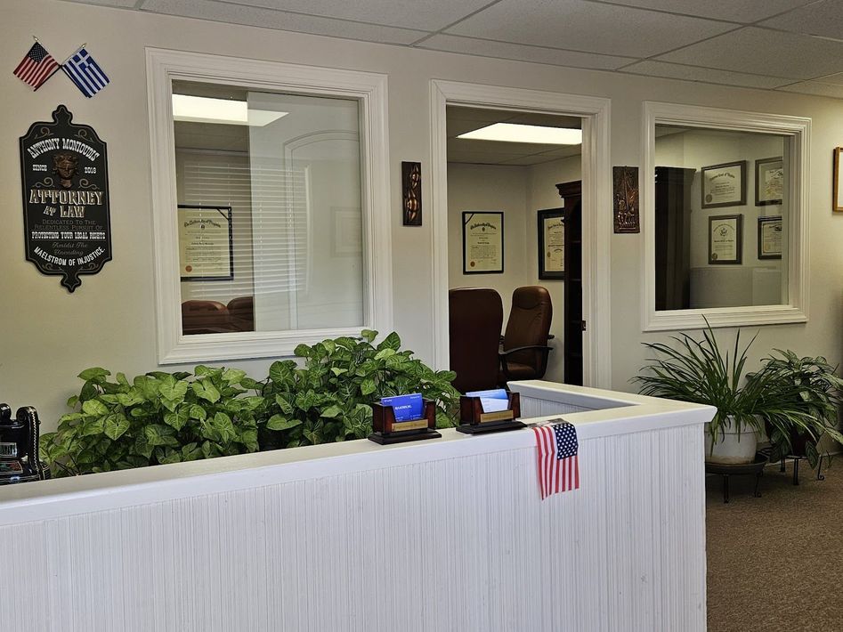 A police badge hangs on the wall above the reception desk