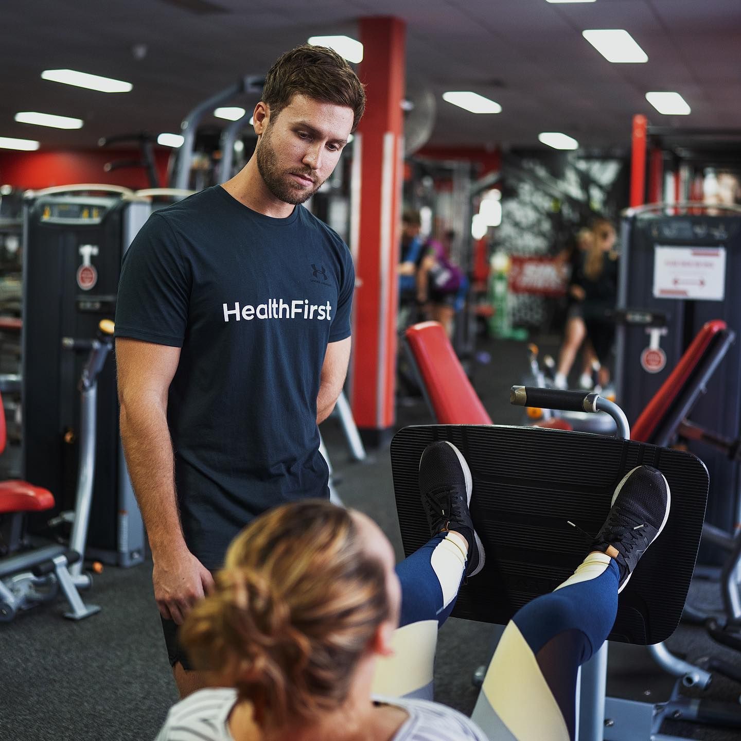 A Man Wearing a Black Shirt That Says Healthfirst β Health First Townsville In Townsville, QLD