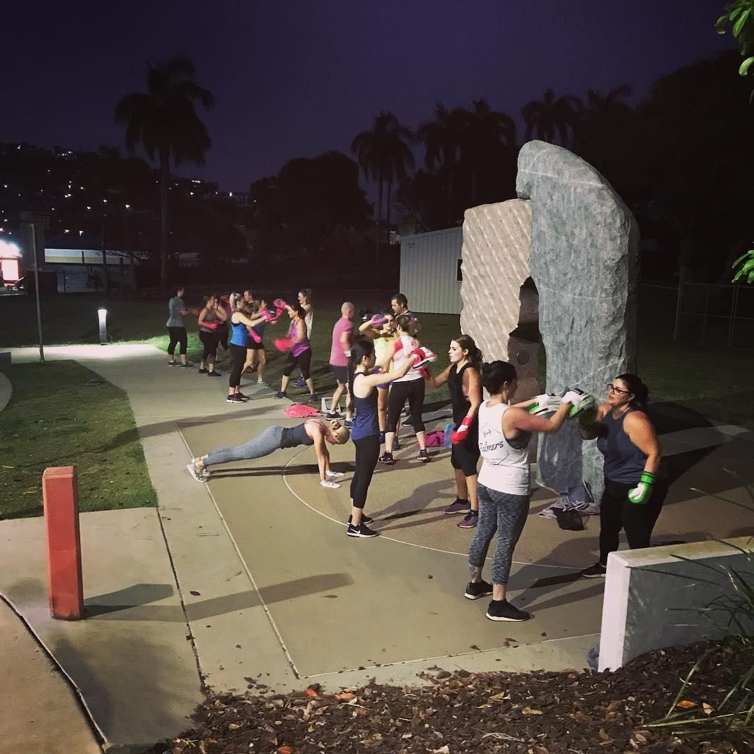 A Group of People Practicing Boxing in The Night — Health First Townsville In Townsville, QLD